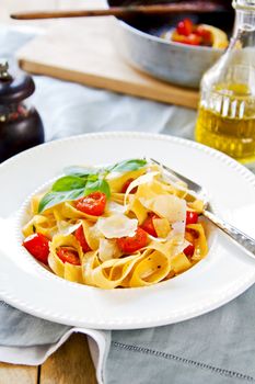 Tagliatelle with cherry tomato and Parmesan on top