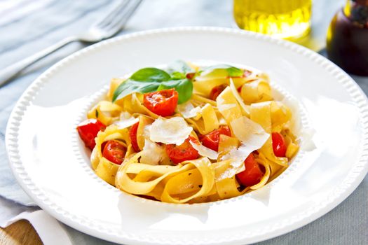 Tagliatelle with cherry tomato and Parmesan on top