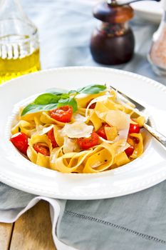 Tagliatelle with cherry tomato and Parmesan on top