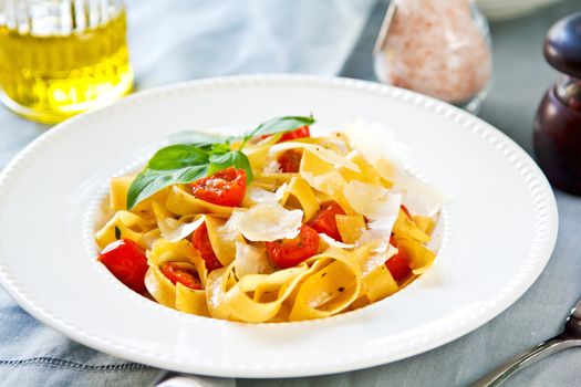 Tagliatelle with cherry tomato and Parmesan on top