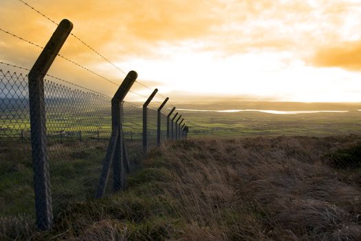 barbed wire fencing protecting a site on the Knockanore hill in Ballybunion county Kerry Ireland