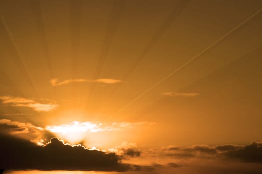 beautiful cloudy orange sunset sky in the wild Atlantic way, Ireland with sunbeams