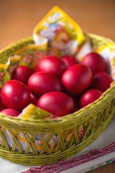 Many of Red Easter Eggs in a Yellow Basket