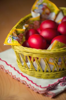 Many of Red Easter Eggs in a Yellow Basket