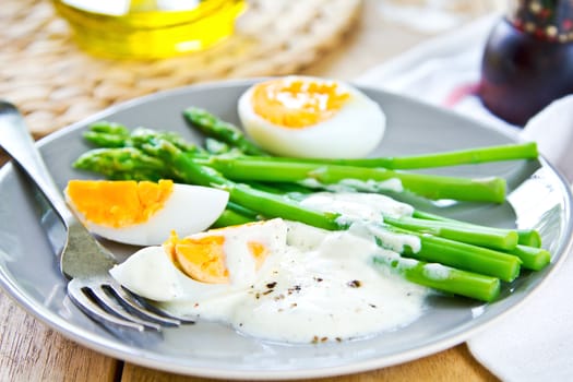 Steamed Asparagus with boiled eggs and sour cream dressing