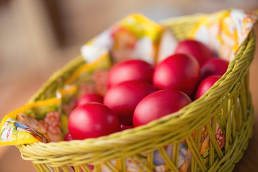 Many of Red Easter Eggs in a Yellow Basket