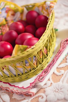 Many of Red Easter Eggs in a Yellow Basket