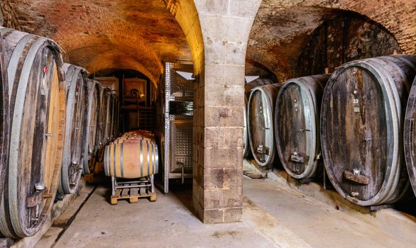 An Old Wine Cellar With Wooden Barrels