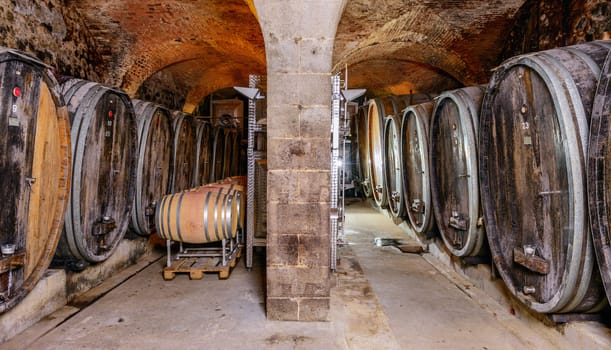 An Old Wine Cellar With Wooden Barrels