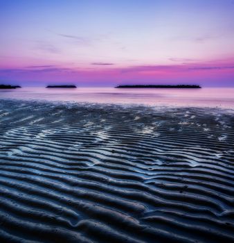 Sunrise by the sea in an italian beach