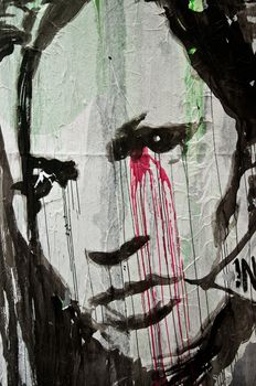 urban art  street in Paris- woman face with blood