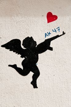 urban Art street in paris - angel with shootgun