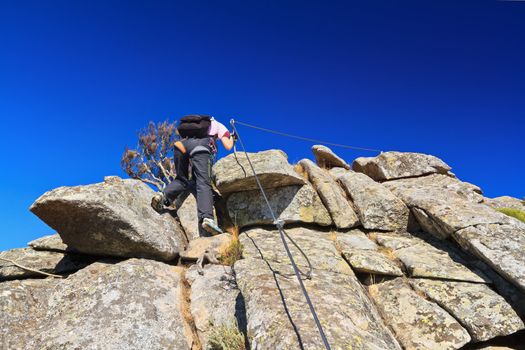 woman on via Fearrata in Capanne mount, Elba island, Italy