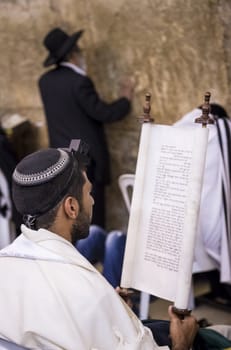 JERUSALEM - JULY 29 : Jewish men prays in the Wailing wall during the Jewish holyday of Tisha B'av , on July 29 2012 in old Jerusalem , Israel 