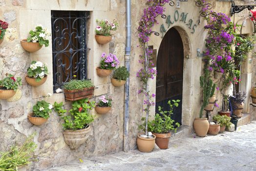 Typical Mediterranean Village with Flower Pots in Facades in Valldemossa, Mallorca, Spain ( Balearic Islands )