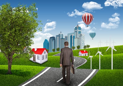 Businessman with briefcase on the road. Green grass, blue sky and buildings as backdrop