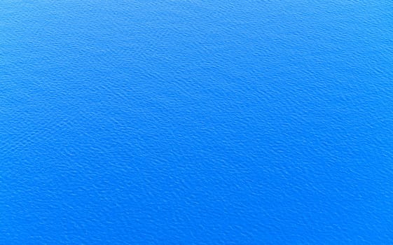 Blue glassy water surface with ripple and reflection of sunlight