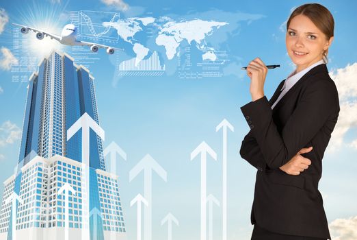 Businesswoman with pen looking at camera. World map, buildings and arrows as backdrop