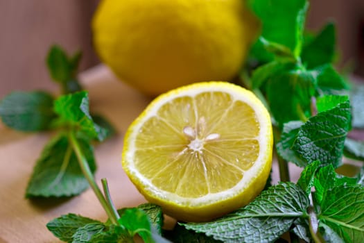 Cut the lemon and mint are on the board