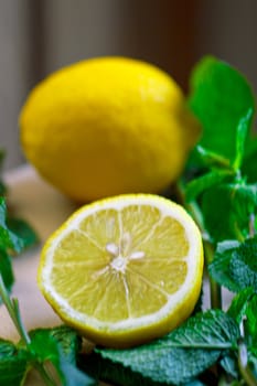 Cut the lemon and mint are on the board