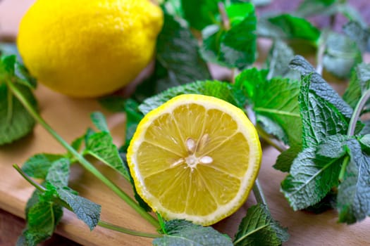 Cut the lemon and mint are on the board