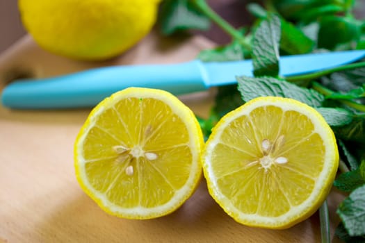 Cut the lemon and mint are on the board