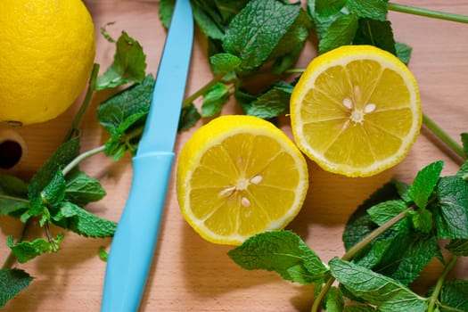 Cut the lemon and mint are on the board