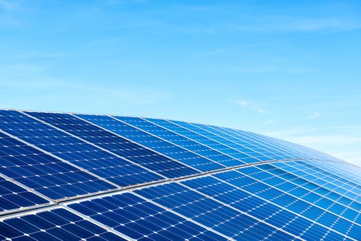 Solar Panels Against The Deep Blue Sky