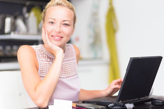 happy business woman working from her home having more time for her family.