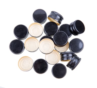 A Pile of Black Metal Screw Caps Isolated On White Background