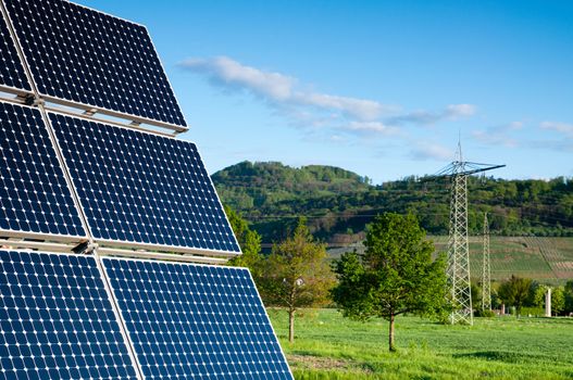 Solar Panel With Green Landscape Against The Blue Sky