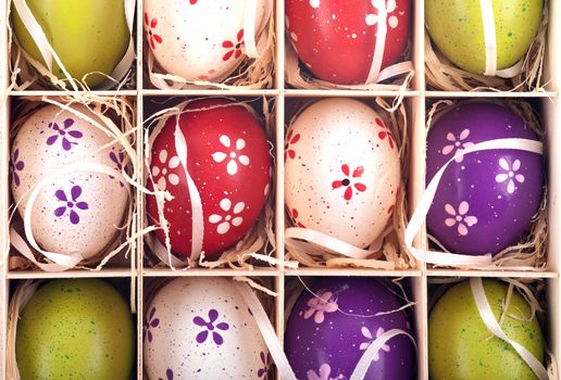 Colorful Painted Easter Eggs in a Wooden Box