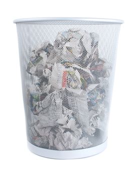 Metal trash bin is full of paper isolated on white