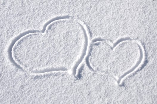 Lovely Hearts Drawn in the Snow in Winter