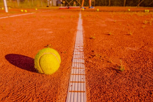 Tennis training session with a ball at the line