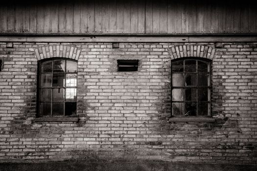 Grungy old barn with two broken windows
