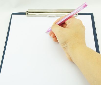 Women are writing notes on a white paper, placed on the board.                               