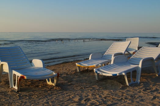 Chaise longue on the Baltic beach in evening