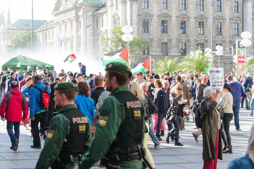 MUNICH, GERMANY - AUGUST 16, 2014: German police to maintain order on the pro-Palestinian demonstration. European activists demand freedom and independence for the people of Gaza and to stop the war.