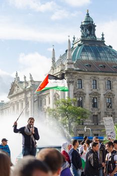 MUNICH, GERMANY - AUGUST 16, 2014: Palestinian demonstration in the center of the European Union. The protesters are demanding the release of the occupied Palestinian territories and the withdrawal from the Gaza Strip.