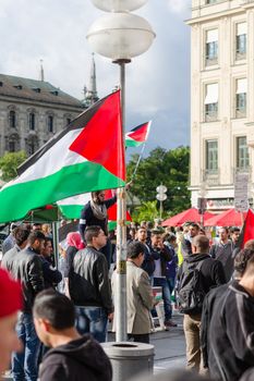 MUNICH, GERMANY - AUGUST 16, 2014: Palestinian flags, slogans and posters. Demonstration for peace, freedom and independence, and ending the war in Gaza.