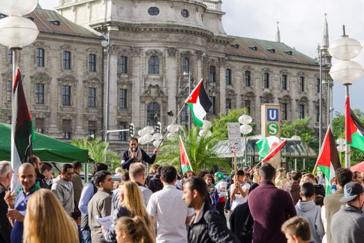 MUNICH, GERMANY - AUGUST 16, 2014: Anti-war rally in support of the Palestinian people. Protesters are asked to stop firing of Gaza Strip and the withdrawal of Israeli troops from the occupied territories.