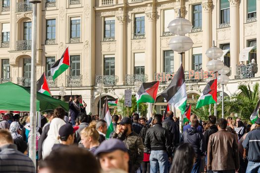 MUNICH, GERMANY - AUGUST 16, 2014: Palestinian activists hold a rally in the center of a major European city against the war in Gaza. Protesters demand that the Israeli government freedom and independence.