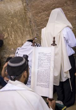 JERUSALEM - JULY 29 : Jewish men prays in the Wailing wall during the Jewish holyday of Tisha B'av , on July 29 2012 in old Jerusalem , Israel 