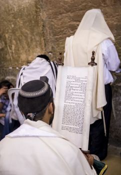 JERUSALEM - JULY 29 : Jewish men prays in the Wailing wall during the Jewish holyday of Tisha B'av , on July 29 2012 in old Jerusalem , Israel 