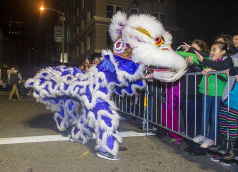 SAN FRANCISCO - FEB 15 : An unidentified participants in a Lion dance at the Chinese New Year Parade in San Francisco , California on February 15 2014 , It is the largest Asian event in North America 