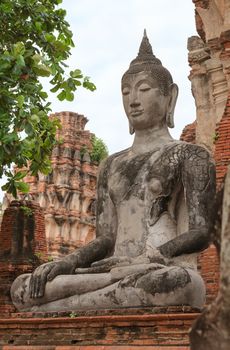 Old Buddha statue in meditate bhumisparsha mudra posture at Wat Mahathat, Ayutthaya, Thailand 