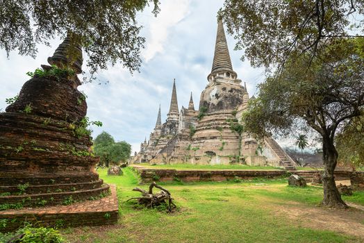 Ruins of ancient stupa chedis at Wat Phra Sri Sanphet Buddhist temple. Asian religious architecture in Ayutthaya, Thailand 