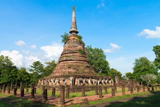 Ruins of Buddhist stupa or chedi in Sukhothai historical park in Wat Chang Lom. The old town was a capital of Sukhothai kingdom, Thailand.