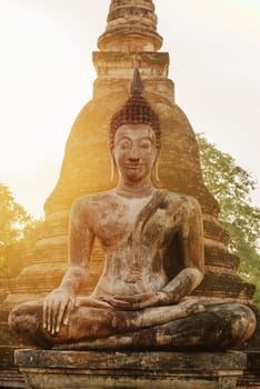 Buddha statue in old Buddhist temple ruins. Buddha statue in Sukhothai historical park Wat Tra Phang Ngoen.